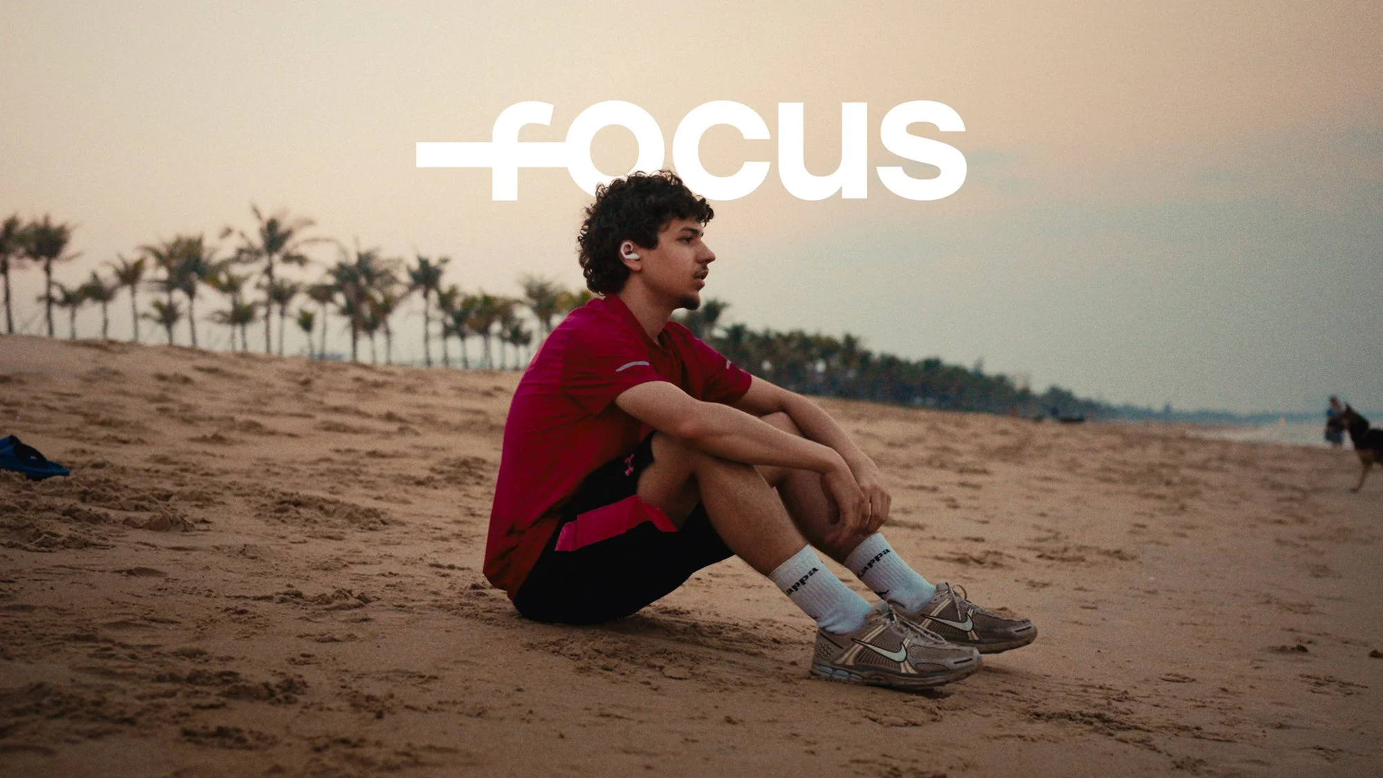 Campaign frame — sitting on the beach